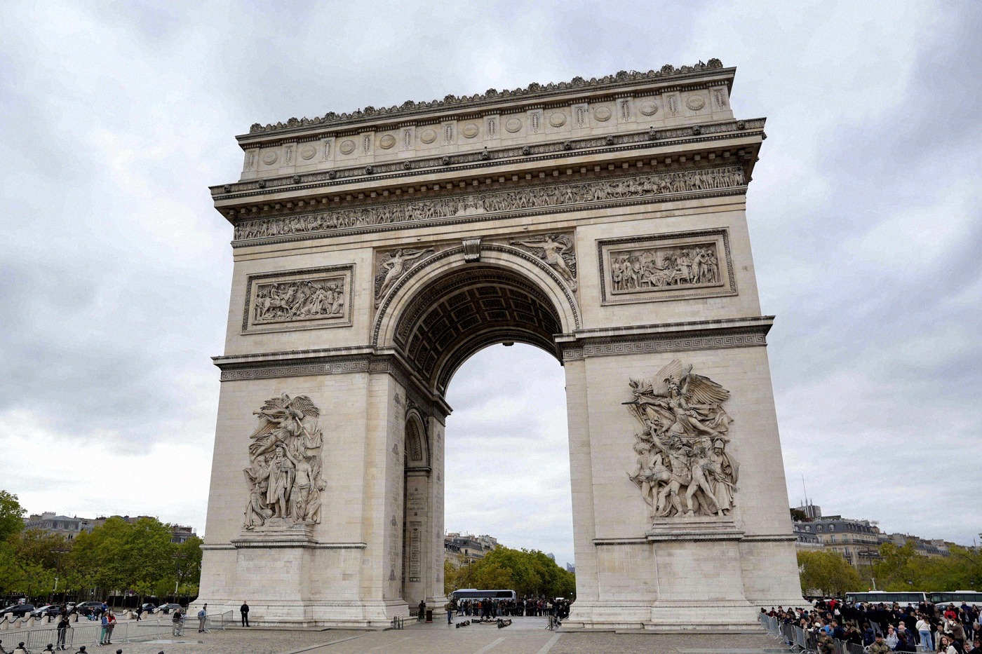 Close-up of the Arc de Triomphe with its detailed reliefs on the piers, taken on an overcast